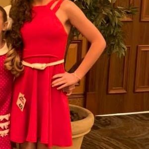 Cute short red dress.